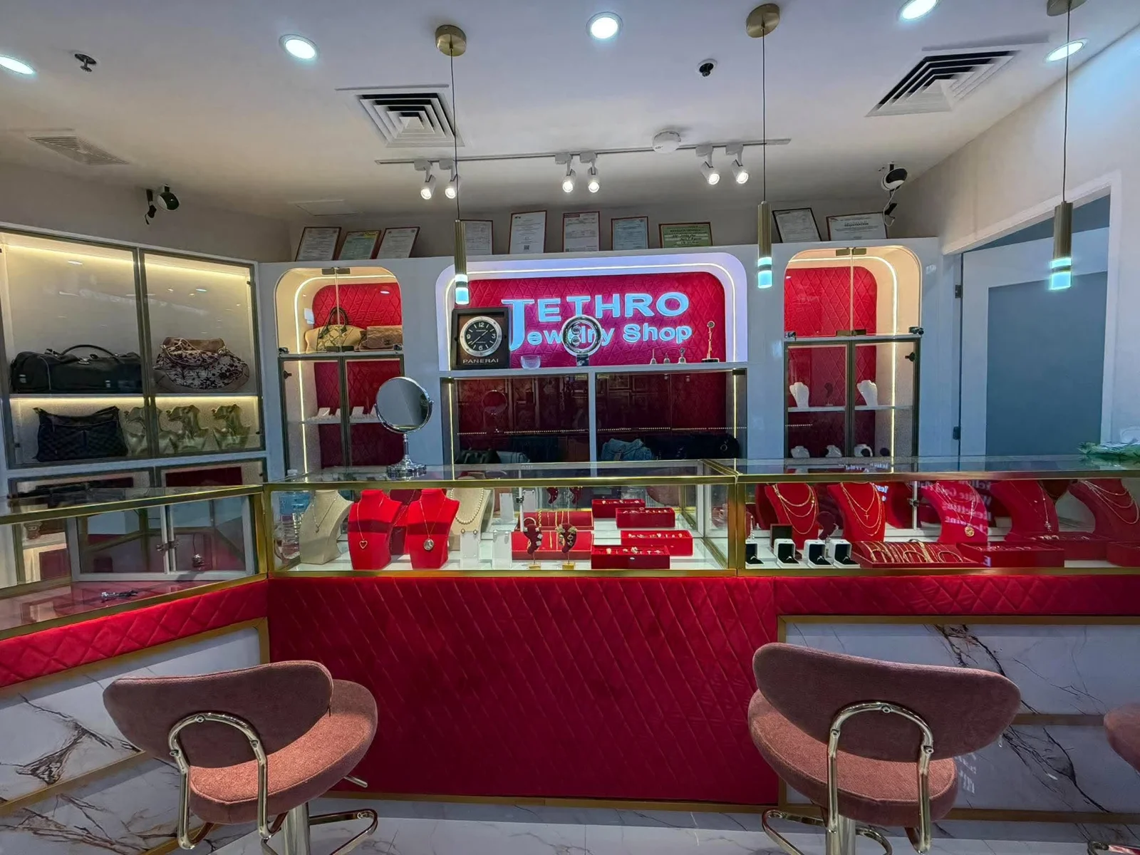 Inside Jethro Jewelry Shop: jewelry counters, framed certificates, and the Jethro sign