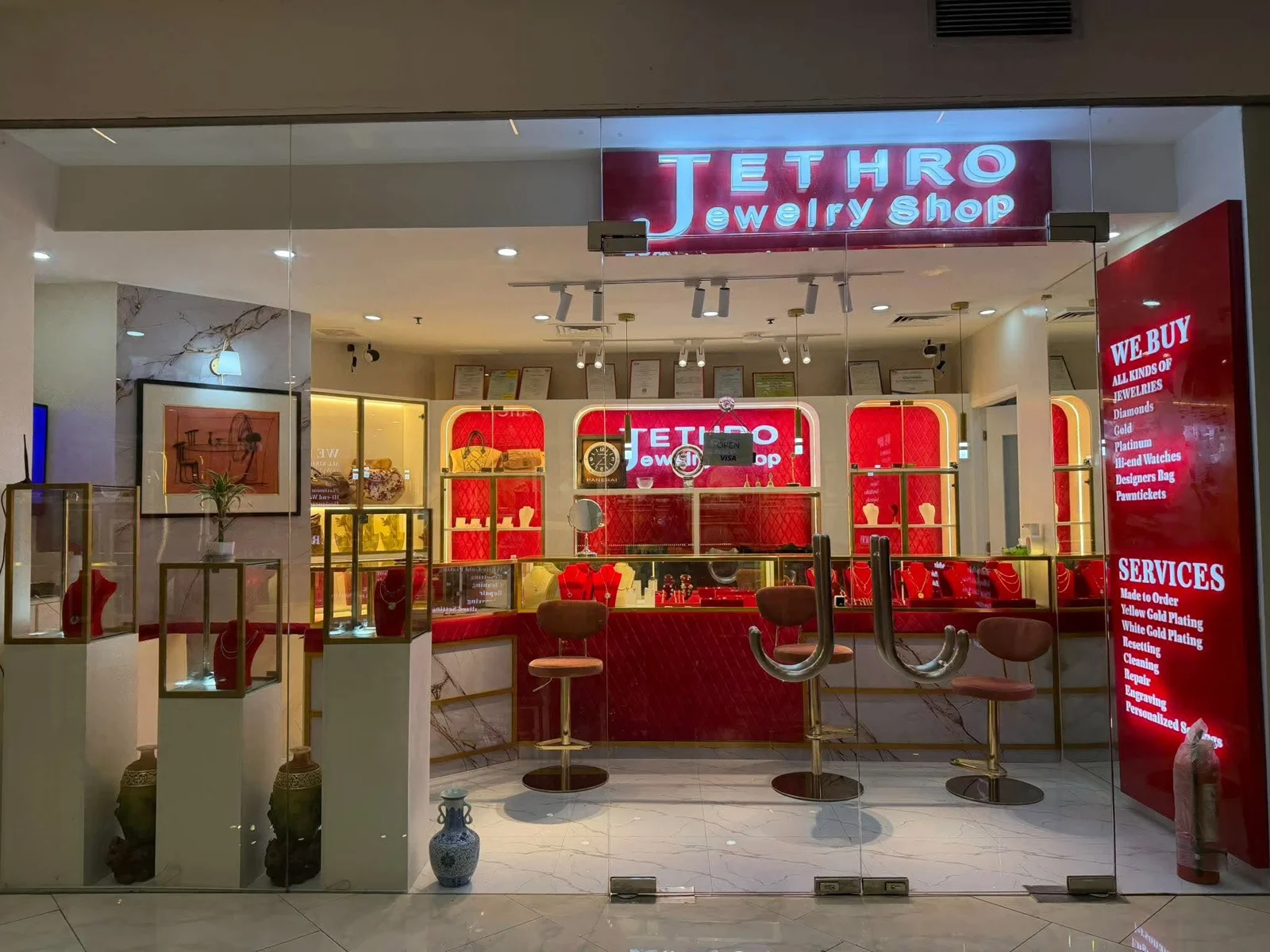 Jethro Jewelry Shop storefront, with its illuminated sign, gold displays and red velvet counters at Robinsons Galleria