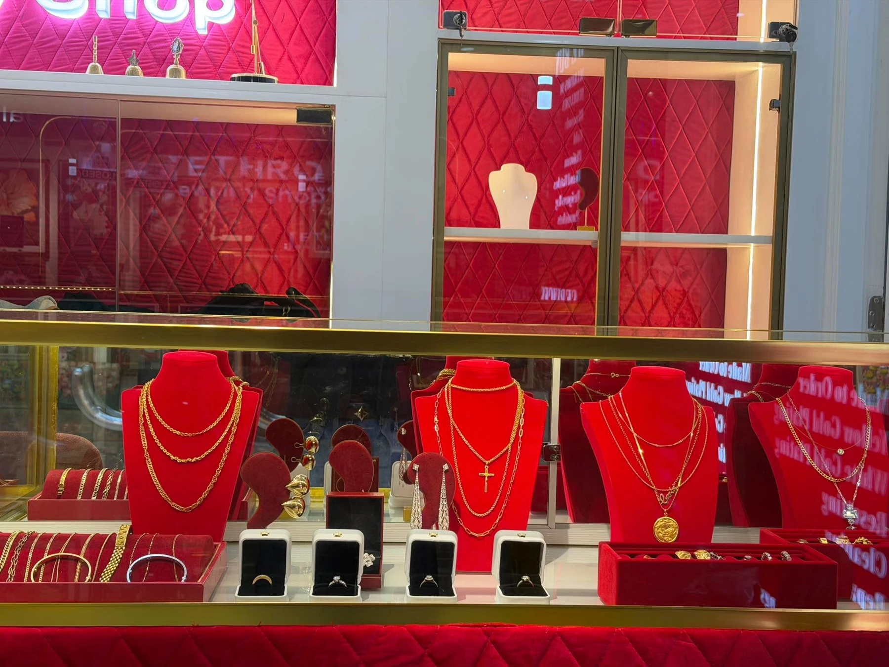 Gold necklaces, rings, earrings and bracelets displayed inside Jethro Jewelry Shop